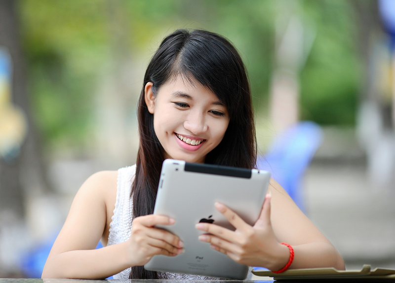 Teen girl looking at an iPad